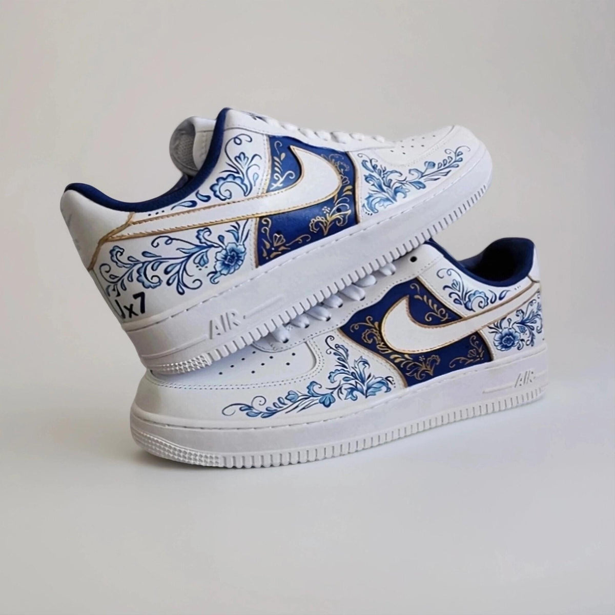 Custom-made white Gzhel- style sneakers, hand-painted with blue floral filigree and gold, a one-of-a-kind gift for AF1 sneakers