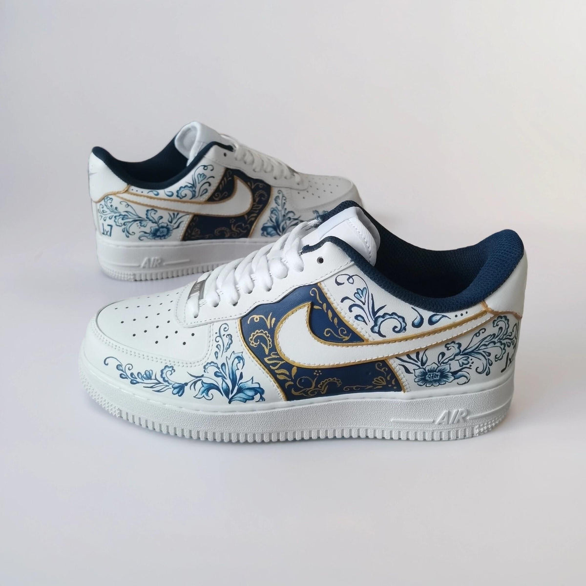 Custom-made white Gzhel- style sneakers, hand-painted with blue floral filigree and gold, a one-of-a-kind gift for AF1 sneakers