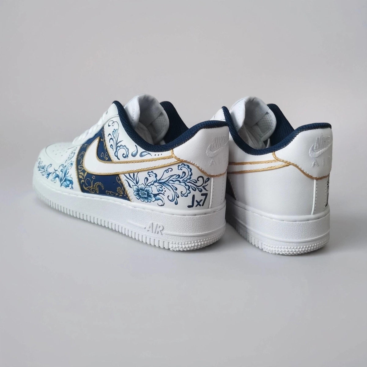 Custom-made white Gzhel- style sneakers, hand-painted with blue floral filigree and gold, a one-of-a-kind gift for AF1 sneakers